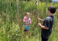 Two children participate in the Pioneer Skills Camp in 2023.