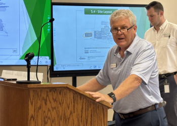 YMCA Executive Director Mike Hollowell addresses the Planning Commission.  Behind him is Town Planning Administrator Justin Schooley.