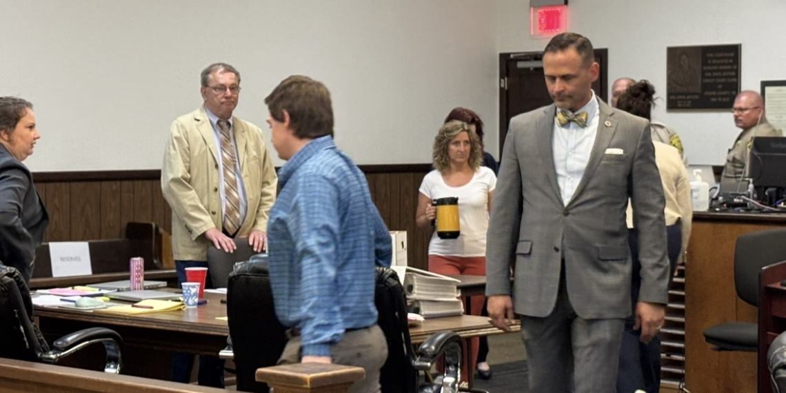 Defendant Jordan Allen (in blue shirt) and his attorney Todd Estep return to the courtroom after the lunch break.
