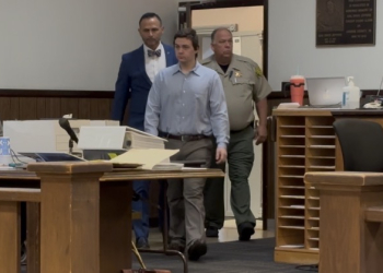 Jordan Allen returns to the courtroom to begin day 4,, trailed by attorney Todd Estep and Charles Morelock, Courthouse Security Chief and Greene County Sheriff's Lieutenant.