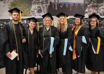 Tusculum University graduate students join together for a photo before the graduation ceremony.