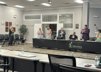 Retiring Director of Schools Steve Starnes receives a standing ovation at the end of the Tuesday night meeting.