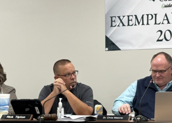 Rick Tipton, along side Board Secretary Annette Farris and Director of Schools Dr. Chris Malone at a recent school board meeting (Radio Greeneville News photo)