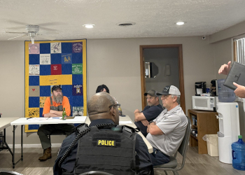 MTAS consultant Brad Peters, right, speaks to the Baileyton Board of Mayor and Aldermen about the town's sewer system finances on Tuesday night.
