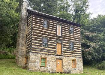The Earnest Fort House is being restored after sustaining damage during Hurricane Helene in 2024. The windows and doors of the structure are currently being repaired and restored.