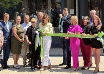 William Sams prepares to cut the ribbon at the Thursday Grand Opening