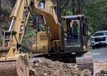 Gary Rector, pictured here making repairs from a roadway slide on Perry Davis Road.