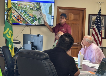 Tusculum Building Inspector Bill Rupert, shown in front of a map of the properties, addresses the board during their Tuesday meeting.