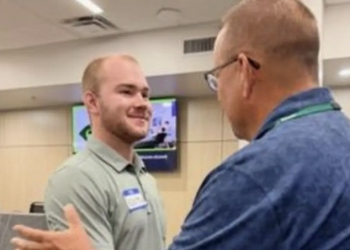 Hunter Johnson, who will be teaching welding at CDHS this school year, meets with School Board Chair Rick Tipton during the first year teachers meeting on Thursday. (Photo from Greene County Schools)
