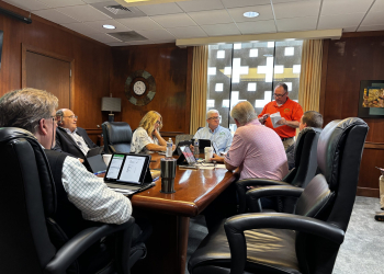 GEA Operations Manager Robert Keller (standing) delivers his monthly Engineering and Operations report to the board.