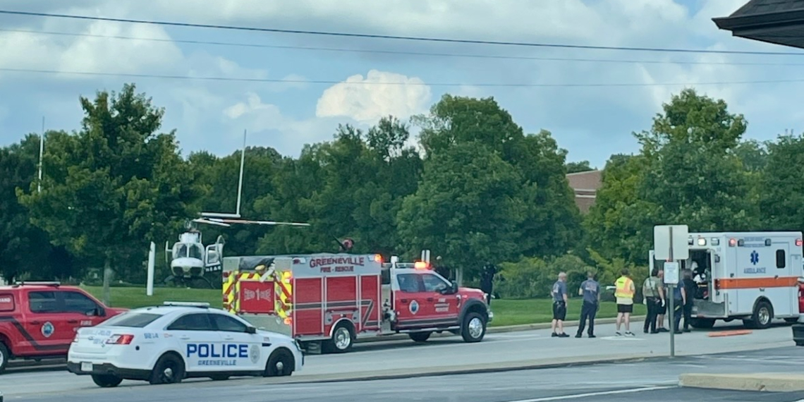 Emergency responders prepare to transfer the patient to the Highlands Air Rescue helicopter