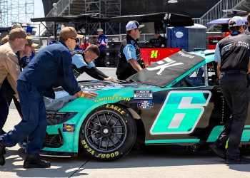 USS Greeneville sailors help push Brad Keselowski's racecar into position during qualifying at NASCAR San Diego Weekend on Naval Base Coronado.