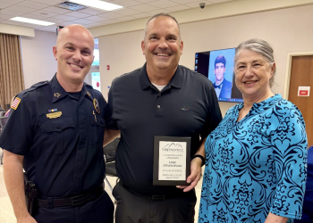 (L-R) Chief Josh Pierce, Steve Spano, high school senior Steve Spano on the screen in the background and Town of Greeneville HR Director Patsy Fuller