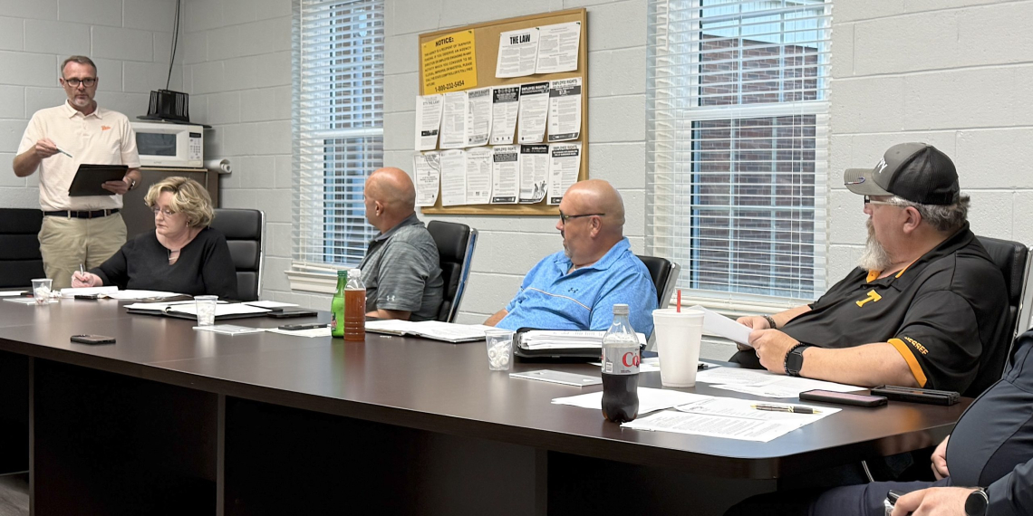 Greene County Commissioner and Engineer Brad Peters, left, speaks to the Mosheim Board of Mayor and Aldermen on Thursday night about an intergovernmental loan of up to $2 million that could be provided to Mosheim from Greene County to install sewer lines at Exit 23 to aid development.