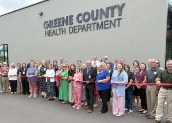 State and local officials prepare to cut a ceremonial ribbon at the new Greene County Health Department facility on Edens Road in Tusculum on Thursday.