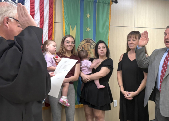 Greene County Mayor Kevin Morrison, right, is sworn in for a third term by Judge Kenneth Bailey Jr., left, on Monday. Mark Britton was also sworn in as County Road Superintendent by Bailey on Monday evening.