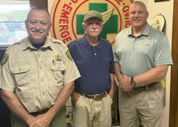 Outgoing Greene County Sheriff Wesley Holt, left, former Greene County Sheriff Steve Burns, center, and incoming Greene County Sheriff David Beverly pose for a photo during a retirement reception held for Holt on Thursday.