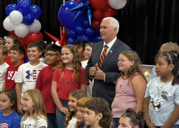 Mike Pence gathers for a photo opp with Doak 4th grade chorus members who sang during the luncheon
