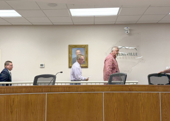 Members of the Greeneville Municipal Airport Authority Board reenter the G. Thomas Love Boardroom at the GEA building on Wednesday after a closed session with legal counsel. The Airport Authority's attorney, Tad Wintermeyer, at far left, follows members of the board back into the room.