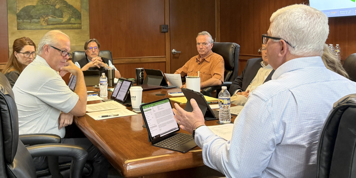 Greeneville Energy Authority Board members listen to GEA President Dwayne Wells as he explains special increased data center rates set for by TVA.
