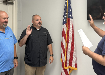 Marc Campbell, left, and Matthew Solomon, center, are sworn in as Mosheim Aldermen by Mosheim Mayor Rick Cunningham, right, on Thursday night.