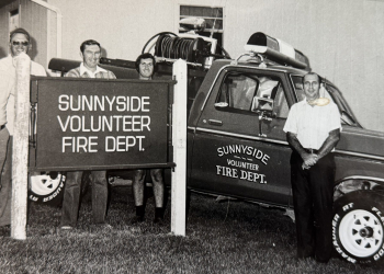 Sunnyside Volunteer Fire Department marked 50 years of service to the community Saturday. This photo from an album at the fire station shows some of the earliest members of the department in the late 1970s.
