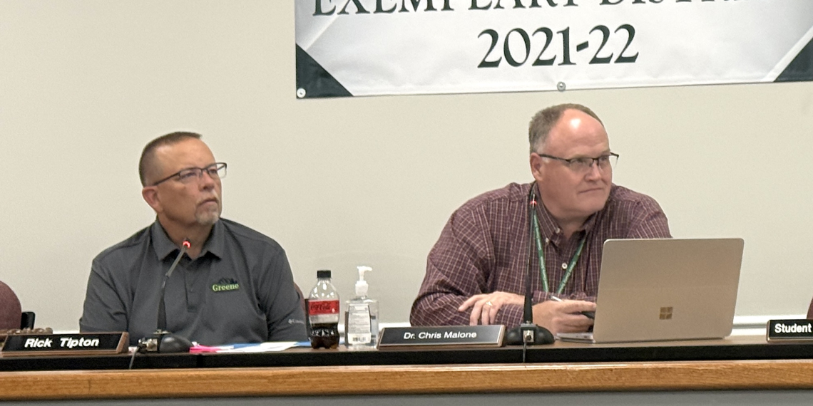 7th District School Board member Rick Tipton, left, and Greene County Director of Schools Dr. Chris Malone, right, listen during Thursday's Greene County School Board meeting. Tipton remained chairman of the board during its annual reorganization.