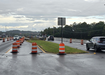 Traffic moves across the bridge over Snapps Ferry Road on U.S. Highway 11E. State officials are not targeting a fall completion for the prolonged project.