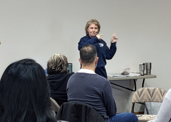 Wendy Peay discusses plans with a group of volunteers.