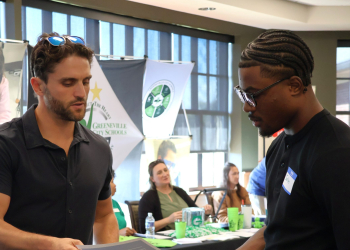 Justin Williams discusses potential positions with a vendor.