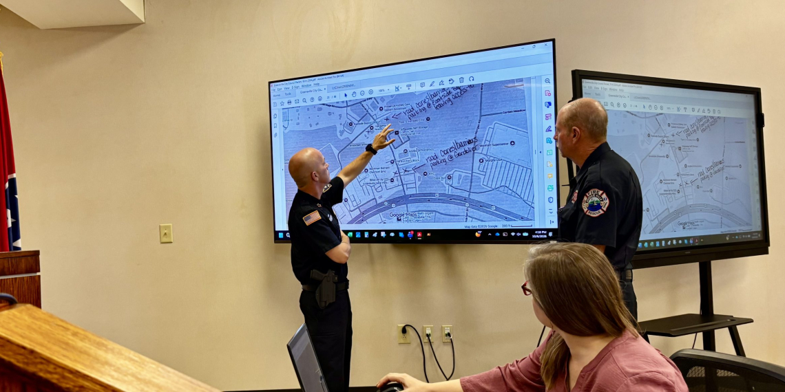Greeneville Police Chief Josh Pierce (L) and Greeneville Fire Chief Alan Shipley address the area where the event was to be held.  In the foreground is Greeneville Media and Marketing Specialist Christina Potts.